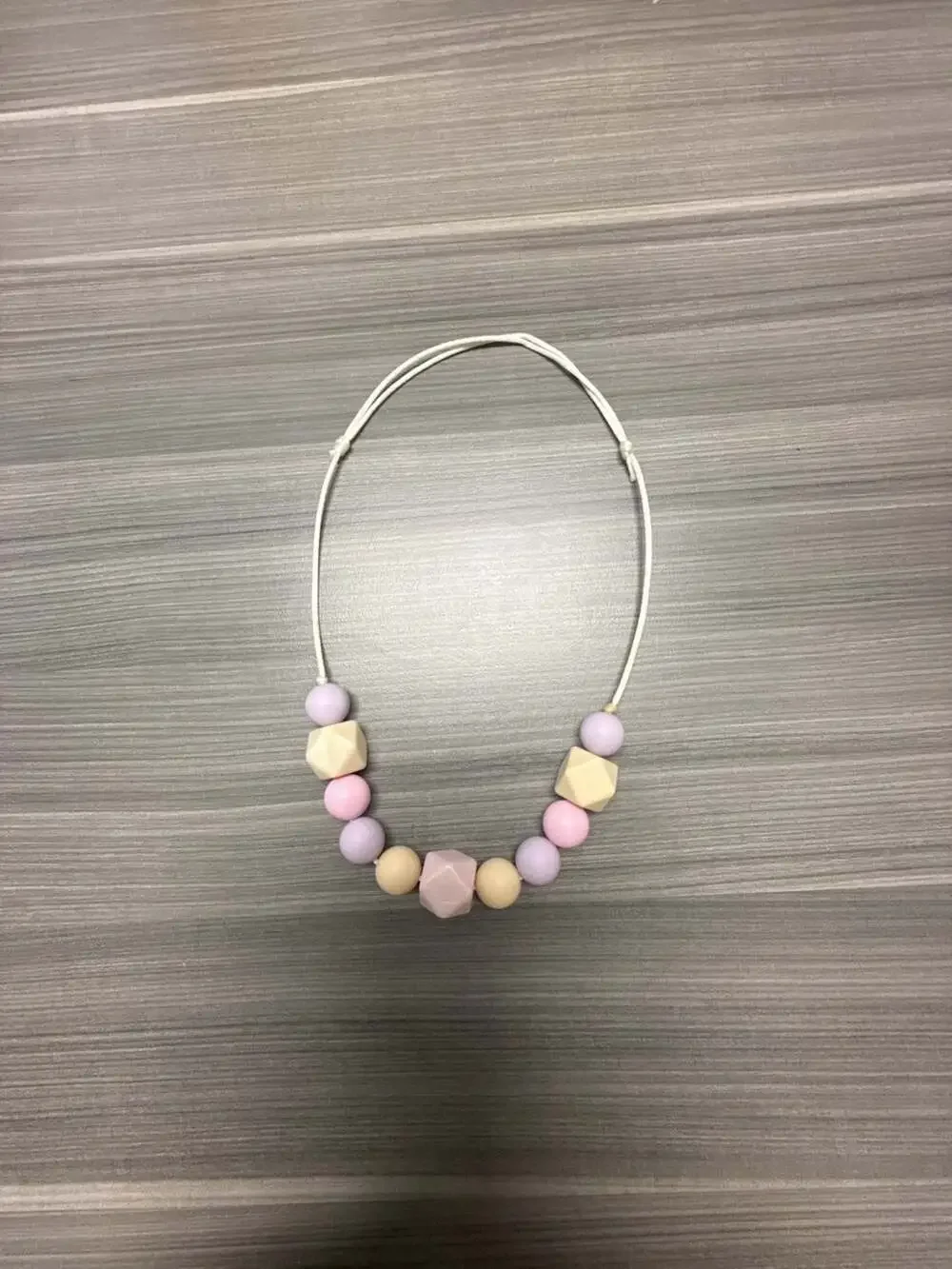 Silicone Teething and Nursing Necklace with Geometric and Round Pastel Beads